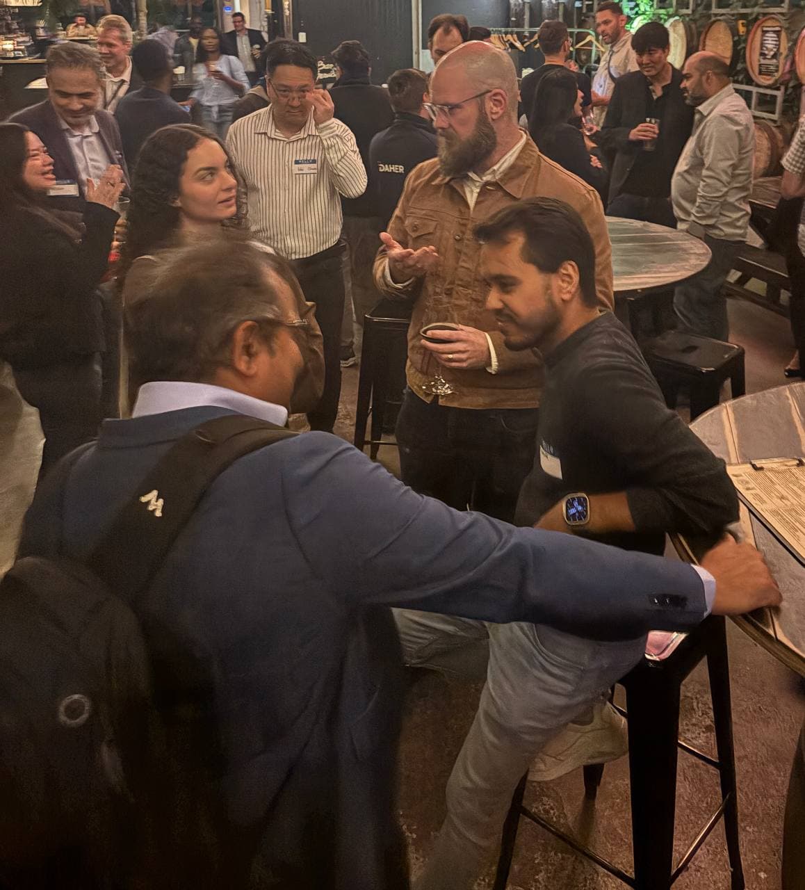 Founders talking beside the bar in Toronto