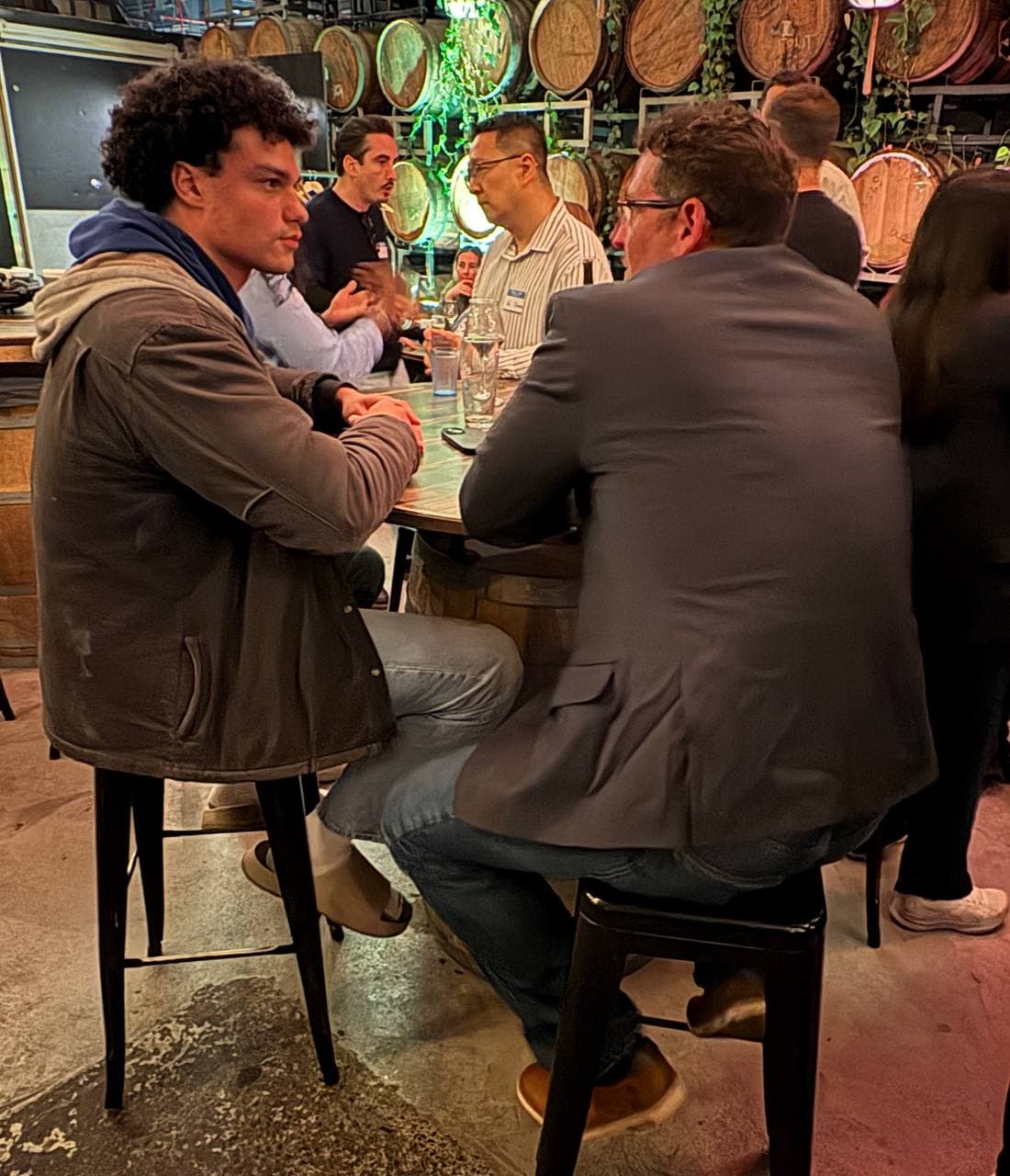 Investor and founder talking across a table