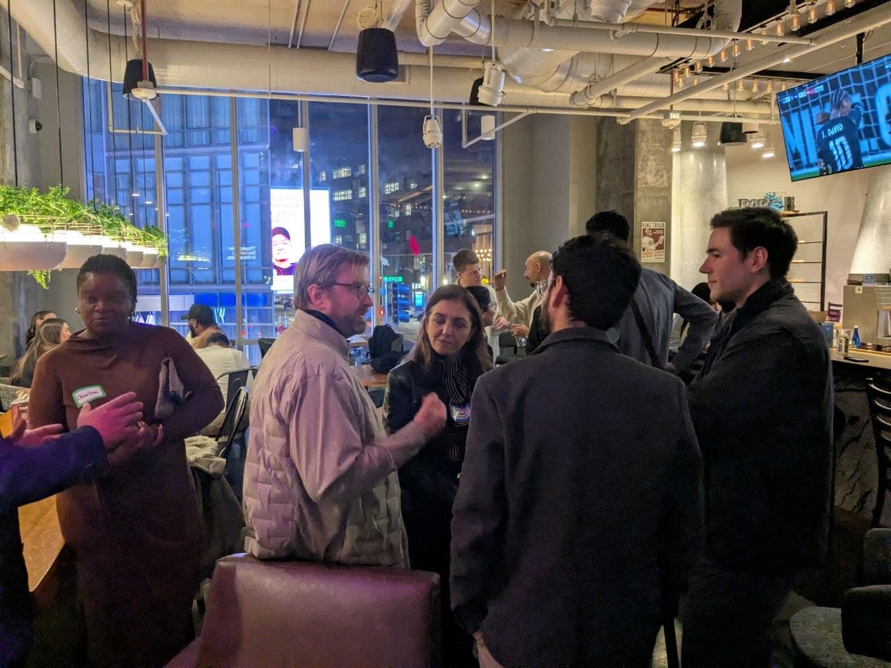 Startup founders talking at Bar Moxy Boston