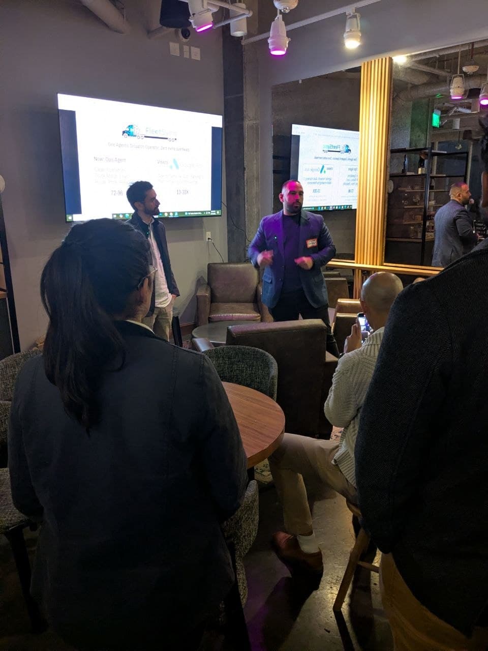 Audience watching FleetSynq startup pitch in Boston
