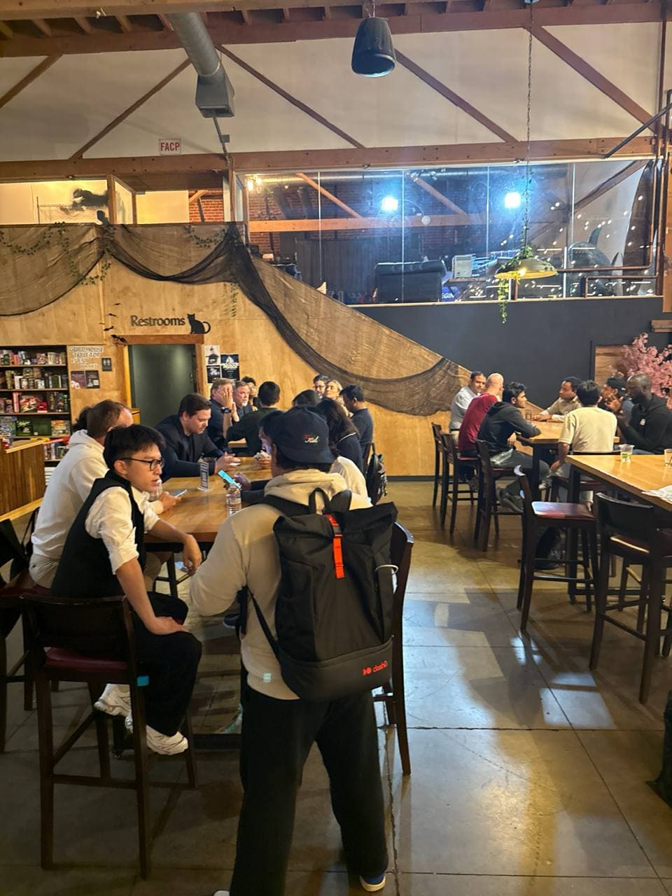 Guests talking at high tables in San Jose