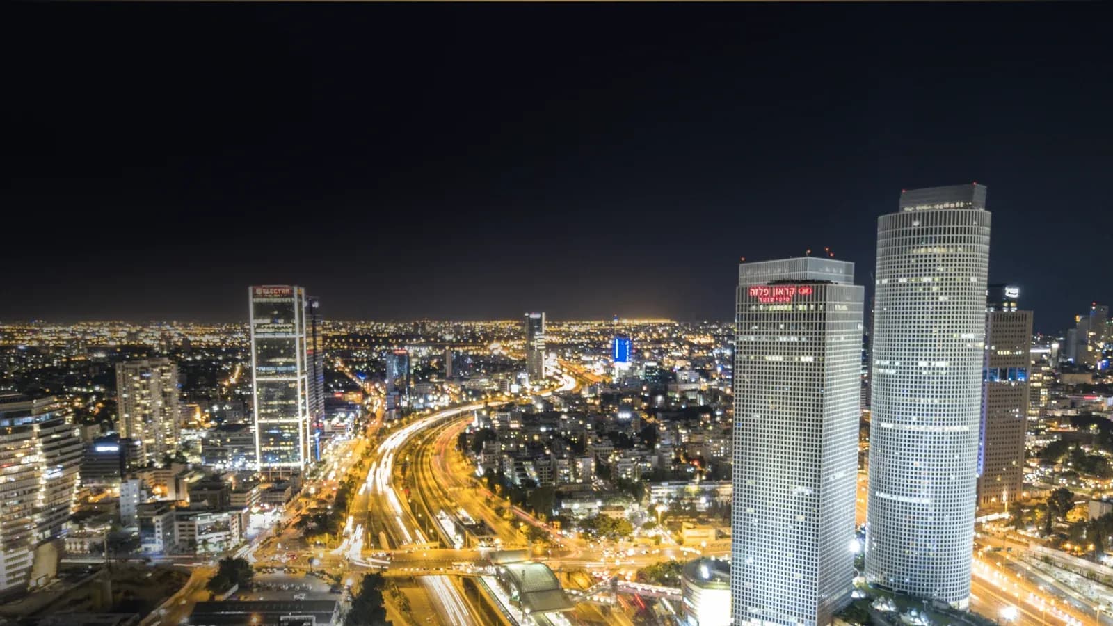 Tel Aviv towers and Ayalon highway at night