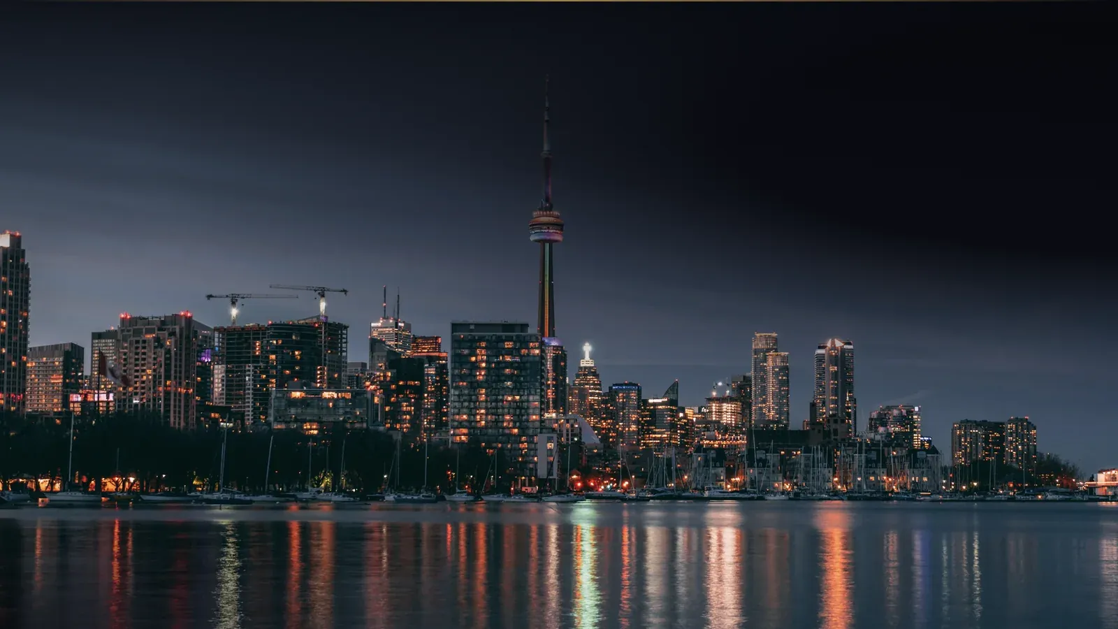 Toronto waterfront and the CN Tower at dusk